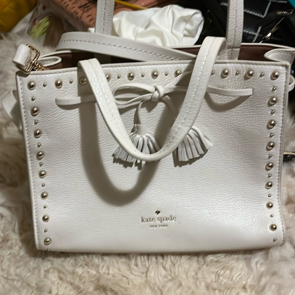 White Kate Spade bag, never used with dust bag. Cat friendly home.